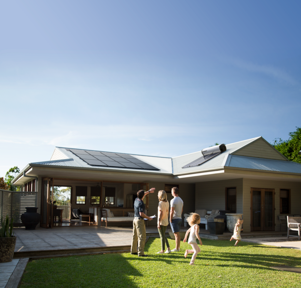 family home solahart solar assessment with solar expert in backyard